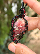 Load image into Gallery viewer, Artisan cab (johari gems) lava vein crazy lace agate with garnet + obsidian gem accents wire wrapped pendant necklace
