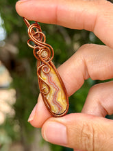Load image into Gallery viewer, Artisan cab (casdans) yellow crazy lace agate with citrine gem accent wire wrapped pendant necklace
