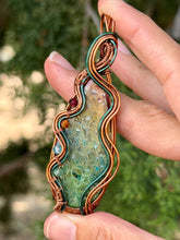 Load image into Gallery viewer, artisan cab (positive rock) rainbow fossilized palm root with garnet, carnelian, blue topaz, peridot gem accent wire wrapped pendant necklace
