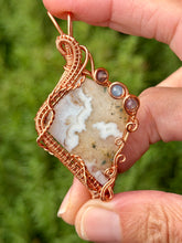 Load image into Gallery viewer, Artisan cab (positive rock) white plume agate with amethyst + aquamarine gem accents wire wrapped pendant necklace
