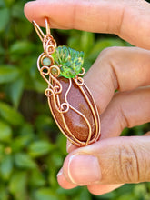 Load image into Gallery viewer, Goldstone “pumpkin” with green aventurine + peridot gem accents wire wrapped pendant necklace
