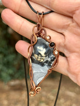 Load image into Gallery viewer, Artisan stone (cab by positive rocks) Black scenic Maligano Jasper with mother of pearl + onyx inclusions Wire wrapped pendant
