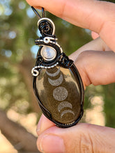 Load image into Gallery viewer, Artisan cab (Marina rabinskaya) Golden sheen obsidian “moon phases” with selenite gem accents wire wrapped pendant necklace
