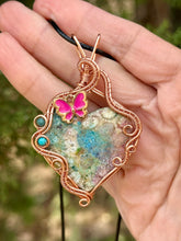 Load image into Gallery viewer, Artisan cab (adit stones) rainbow fossilized coral with blue apatite, turquoise, peridot gem accents wire wrapped pendant necklace
