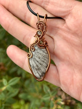 Load image into Gallery viewer, Fossilized black coral with green fluorite + peridot gem inclusions wire wrapped pendant necklace
