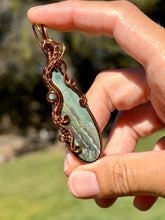 Load image into Gallery viewer, Artisan cab (positive rocks) Indian agate with blue kyanite gem accent wire wrapped pendant necklace
