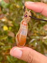 Load image into Gallery viewer, ARTISAN cab (positive rocks) Carnelian with ruby accent wire wrapped pendant necklace
