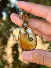 Load image into Gallery viewer, Artisan cab (positive rock) polychrome desert jasper with  green fluorite gem accents wire wrapped pendant necklace
