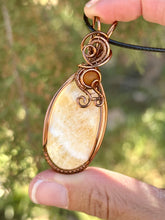 Load image into Gallery viewer, Yellow/orange calcite with amber gem accent wire wrapped pendant necklace
