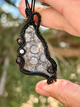 Load image into Gallery viewer, artisan cab (positive rock) black fossilized coral with obsidian + moonstone gem stone accents wire wrapped pendant necklace
