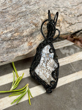 Load image into Gallery viewer, Artisan cab (positive rocks) black fossilized coral with obsidian + rutile quartz gem accents wire wrapped pendant necklace

