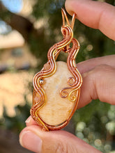 Load image into Gallery viewer, Orange calcite with sunstone + hematite gem accents wire wrapped pendant necklace
