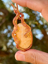 Load image into Gallery viewer, Orange calcite with sunstone + hematite gem accents wire wrapped pendant necklace
