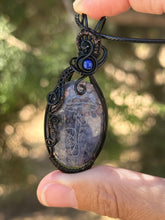 Load image into Gallery viewer, Artisan cab (Marina Rabinskaya) dragon vein agate with lapis lazuli gem accent wire wrapped pendant necklace
