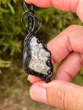 Load image into Gallery viewer, Artisan cab (positive rocks) black fossilized coral with obsidian + rutile quartz gem accents wire wrapped pendant necklace
