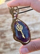 Load image into Gallery viewer, Rose cut lepidolite with peach moonstone + ruby inclusions   Wire wrapped pendant
