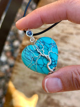 Load image into Gallery viewer, Blue (dyed) Magnesite tree of life with sapphire inclusion Wire wrapped pendant
