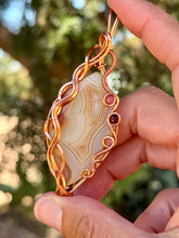 Load image into Gallery viewer, Artisan cab (positive rocks) orange botswana agate with sunstone + garnet gem accent wire wrapped pendant necklace
