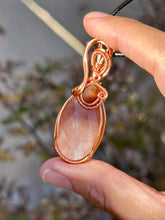 Load image into Gallery viewer, Faceted peach moonstone with amber gem inclusions wire wrapped pendant necklace
