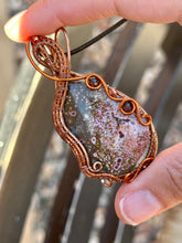 Load image into Gallery viewer, DUO TONED WIRE + DESIGNER CAB ocean jasper with garnet + carnelian inclusions  Wire wrapped pendant
