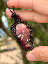 Load image into Gallery viewer, Artisan cab (johari gems) lava vein crazy lace agate with garnet + obsidian gem accents wire wrapped pendant necklace
