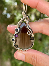 Load image into Gallery viewer, Artisan cab (positive rock) black lace obsidian with blue tiger eye + amethyst gem accent wire wrapped pendant necklace
