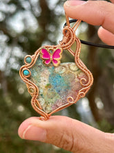 Load image into Gallery viewer, Artisan cab (adit stones) rainbow fossilized coral with blue apatite, turquoise, peridot gem accents wire wrapped pendant necklace
