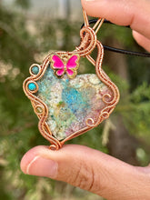 Load image into Gallery viewer, Artisan cab (adit stones) rainbow fossilized coral with blue apatite, turquoise, peridot gem accents wire wrapped pendant necklace
