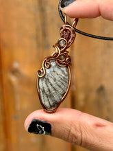 Load image into Gallery viewer, Fossilized black coral with green fluorite + peridot gem inclusions wire wrapped pendant necklace
