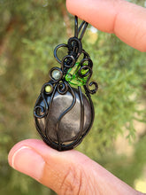 Load image into Gallery viewer, Silver sheen obsidian “pumpkin” with green mica + serpentine gem accents wire wrapped  pendant necklace
