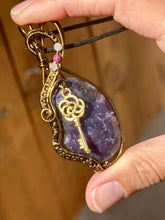 Load image into Gallery viewer, Rose cut lepidolite with peach moonstone + ruby inclusions   Wire wrapped pendant
