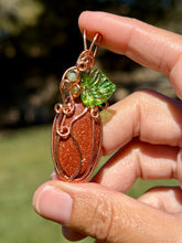 Load image into Gallery viewer, Goldstone “pumpkin” with green aventurine + peridot gem accents wire wrapped pendant necklace
