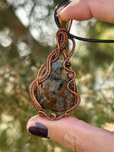 Load image into Gallery viewer, Faceted Pietersite with sapphire + Rhodonite gem inclusions wire wrapped pendant necklace
