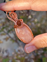 Load image into Gallery viewer, Faceted peach moonstone with amber gem inclusions wire wrapped pendant necklace
