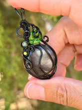 Load image into Gallery viewer, Silver sheen obsidian “pumpkin” with green mica + serpentine gem accents wire wrapped  pendant necklace
