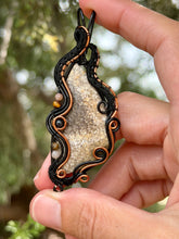 Load image into Gallery viewer, Artisan cab (positive rock) fossilized coral with peach moonstone, tiger eye, black tourmaline gem accents wire wrapped pendant necklace
