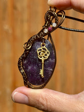 Load image into Gallery viewer, Rose cut lepidolite with peach moonstone + ruby inclusions   Wire wrapped pendant
