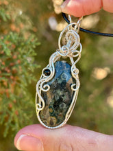 Load image into Gallery viewer, Crinoid fossil with black tourmaline gem accent wire wrapped pendant necklace
