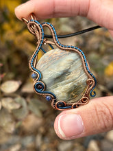 Load image into Gallery viewer, Reserved for ann c DUO TONED WIRE + DESIGNER CAB common blue opal with petrified wood with lapis lazuli + garnet inclusions Wire wrapped pendant
