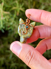 Load image into Gallery viewer, Unakite mini wolf head with blue apatite gem accent wire wrapped pendant necklace
