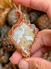 Load image into Gallery viewer, Artisan cab (positive rock) white plume agate with amethyst + aquamarine gem accents wire wrapped pendant necklace
