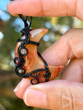 Load image into Gallery viewer, Artisan cab (positive rock) carnelian moon with rutile quartz + garnet gem accents wire wrapped pendant necklace
