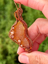 Load image into Gallery viewer, Artisan cab (positive rock) half polished carnelian with druzy with sunstone + rose quartz + copper  gem accents wire wrapped pendant necklace
