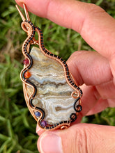Load image into Gallery viewer, Artisan cab (positive rock) white crazy lace agate with chakra gem accents wire wrapped pendant necklace
