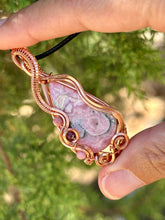Load image into Gallery viewer, Rhodochrosite with Rhodonite and Ruby inclusions wire wrapped pendant talisman necklace
