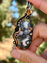 Load image into Gallery viewer, Artisan cab (positive rocks) scenic black maligano with sunstone, hematite, rutile quartz, opalite gem accents wire wrapped pendant necklace
