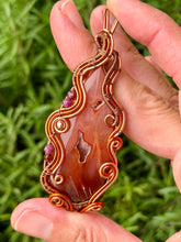 Load image into Gallery viewer, Artisan cab (positive rock) carnelian druzy with garnet + ruby + hematite gem accents wire wrapped pendant necklace
