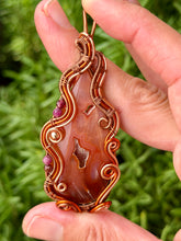 Load image into Gallery viewer, Artisan cab (positive rock) carnelian druzy with garnet + ruby + hematite gem accents wire wrapped pendant necklace
