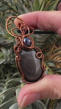 Load and play video in Gallery viewer, Reserved for Jessica s Silver Sheen Obsidian Wire Wrapped Pendent Necklace
