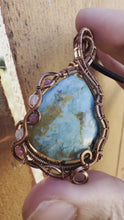 Load and play video in Gallery viewer, Reserved for Jennifer p Sky turquoise with Ethiopian Opal + Ruby Gem Inclusions Wire Wrapped Pendent Necklacee

